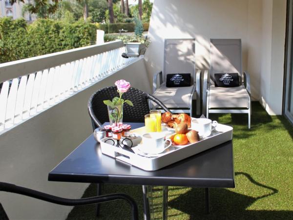 Hôtel Victoria : photo 4 de la chambre chambre double deluxe avec terrasse - vue sur jardin