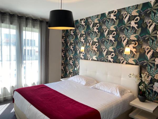 Hôtel Calme Des Pins & Spa : photo 1 de la chambre chambre double avec lit king-size et balcon