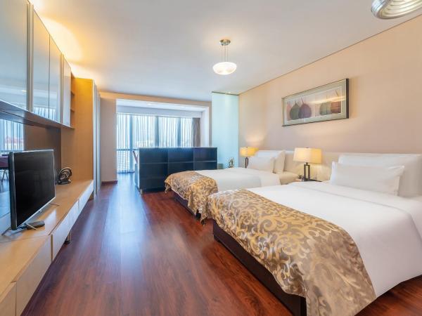 Qingdao Housing International Hotel : photo 1 de la chambre chambre lits jumeaux supérieure