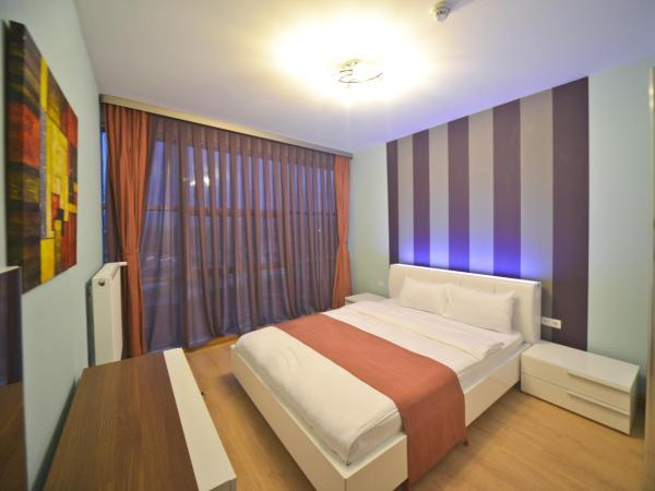 Ekinci Residence : photo 9 de la chambre chambre lit king-size affaires
