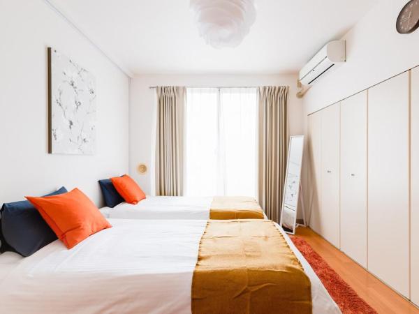 GuestHouse MIYABI : photo 2 de la chambre chambre lits jumeaux avec salle de bains privative