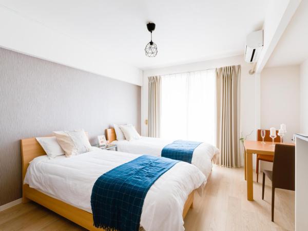 GuestHouse MIYABI : photo 3 de la chambre chambre lits jumeaux avec salle de bains privative