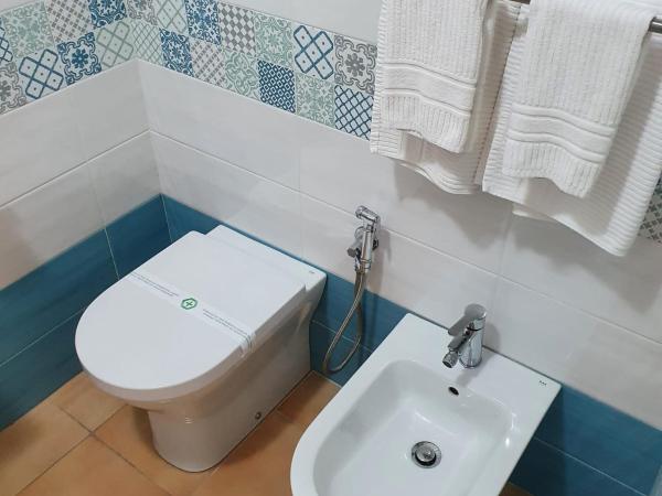 Vittoria Guest House Salerno : photo 3 de la chambre chambre lits jumeaux