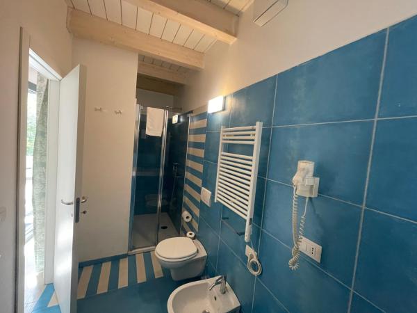 Baia Sangiorgio Hotel & Beach Club : photo 4 de la chambre chambre double ou lits jumeaux - vue sur jardin