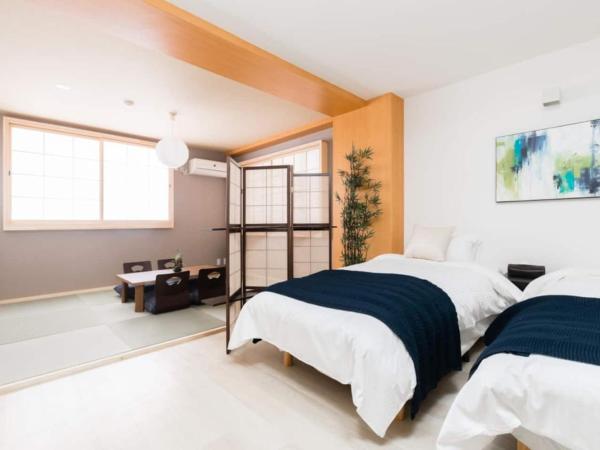 GuestHouse MIYABI : photo 3 de la chambre chambre quadruple avec salle de bains privative