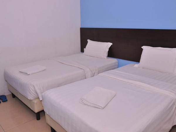 Kuching Transit Inn : photo 1 de la chambre twin room (without window)