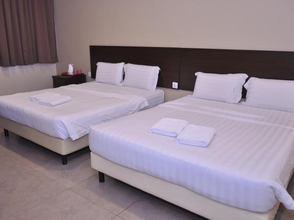 Kuching Transit Inn : photo 1 de la chambre family deluxe (with window)