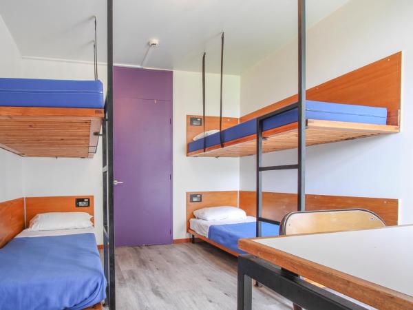AUBERGE DE JEUNESSE DU MOULIN BLANC : photo 6 de la chambre lit simple dans dortoir pour hommes