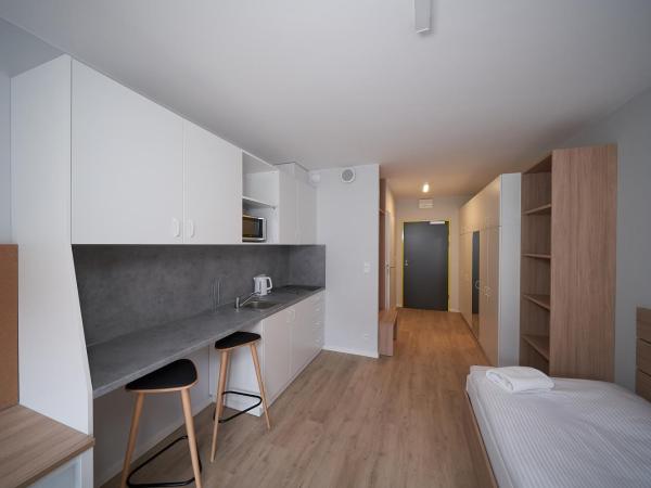 Apartamenty Collegia : photo 3 de la chambre chambre lits jumeaux spacieuse