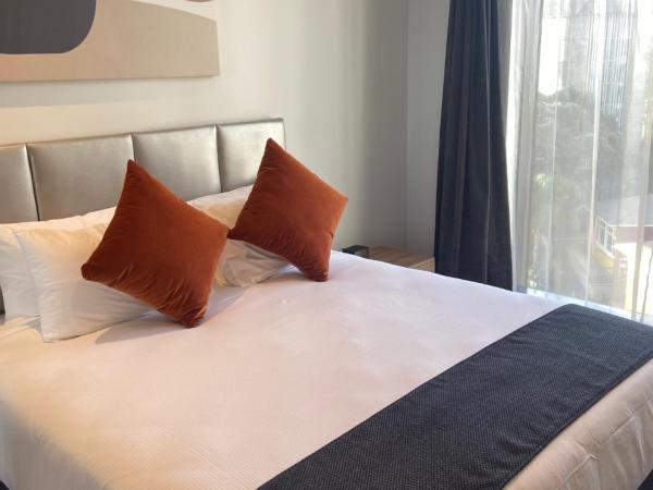 Ramada by Wyndham Newmarket Auckland : photo 8 de la chambre appartement 2 chambres lit king-size avec cuisine