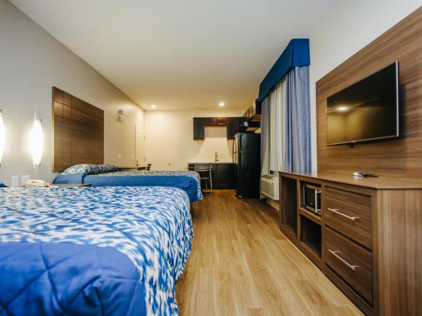 Palace Inn Blue City Centre : photo 3 de la chambre chambre supérieure avec 2 lits queen-size