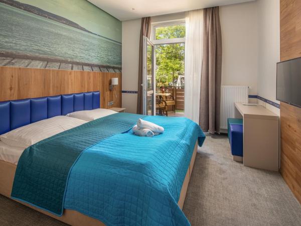 Hotel Solero : photo 2 de la chambre chambre lits jumeaux - vue sur jardin