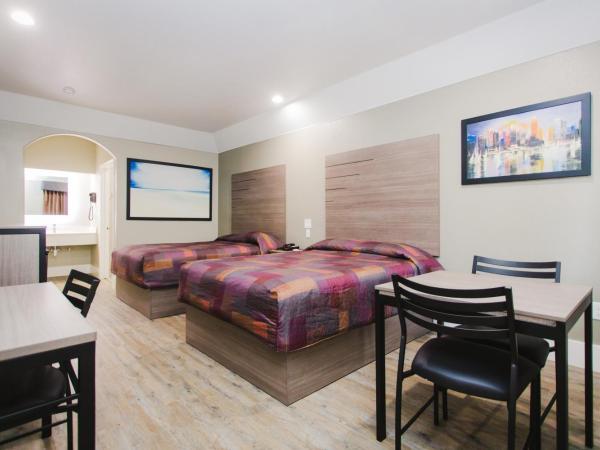 Palace Inn Beltway 8 & Westview : photo 1 de la chambre chambre supérieure avec 2 lits queen-size