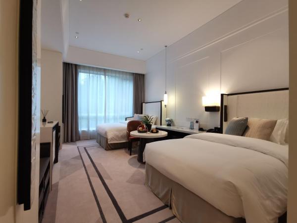 Jinling Resort Nanjing : photo 3 de la chambre chambre lits jumeaux - vue sur jardin