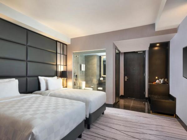 Grand Swiss-Belhotel Darmo : photo 1 de la chambre chambre lits jumeaux deluxe