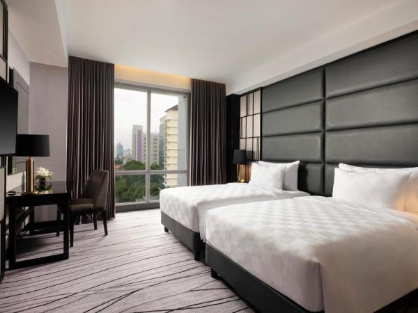 Grand Swiss-Belhotel Darmo : photo 2 de la chambre chambre lits jumeaux deluxe