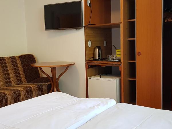 Wynajem pokoi : photo 2 de la chambre chambre triple - vue sur jardin