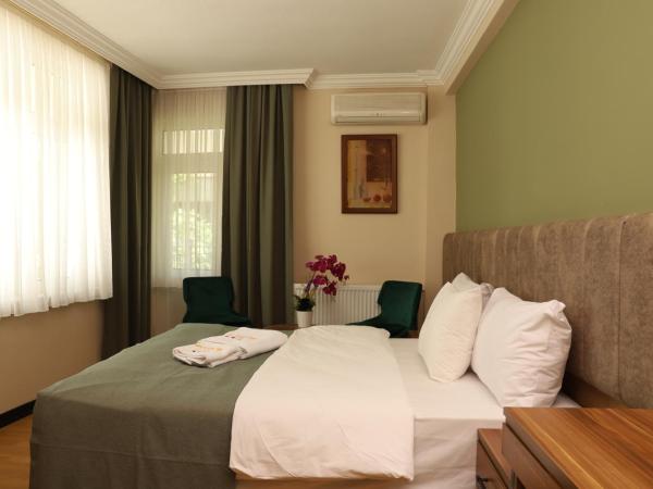 Buldum Otel : photo 5 de la chambre suite lit king-size avec balcon