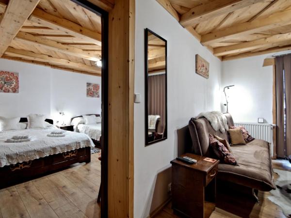 Magnat Inn & Sauna & Relax : photo 1 de la chambre suite familiale avec balcon