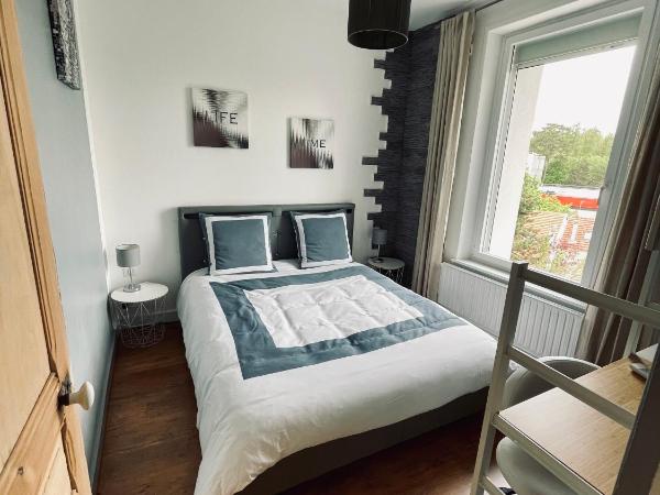 le numero 100 : photo 1 de la chambre chambre lit king-size - vue sur jardin