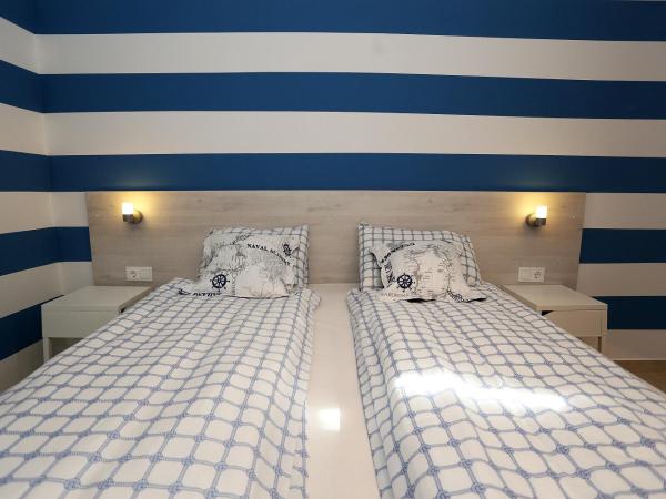 Guesthouse Villa Maggie : photo 3 de la chambre chambre lits jumeaux avec terrasse