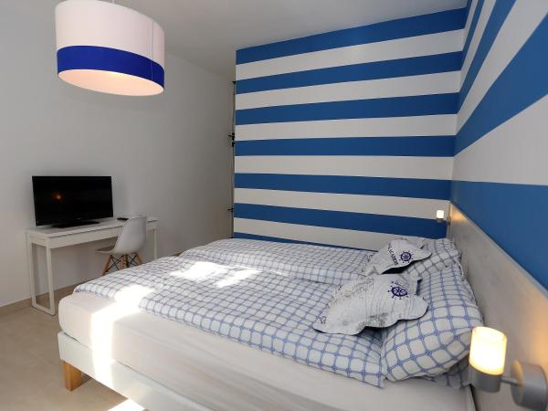 Guesthouse Villa Maggie : photo 4 de la chambre chambre lits jumeaux avec terrasse