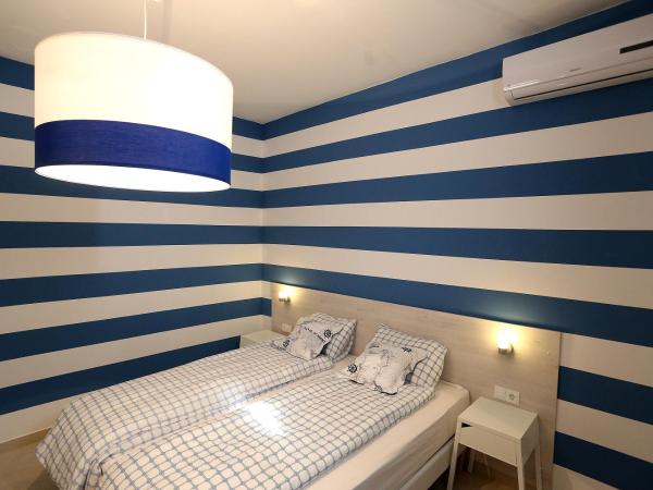 Guesthouse Villa Maggie : photo 1 de la chambre chambre lits jumeaux avec terrasse