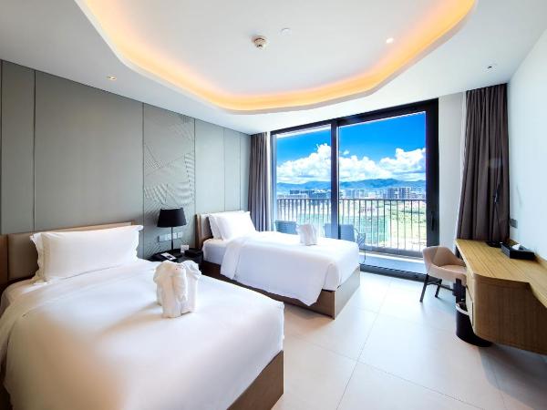 Oakwood Apartments Sanya : photo 3 de la chambre studio lits jumeaux vue sur le jardin