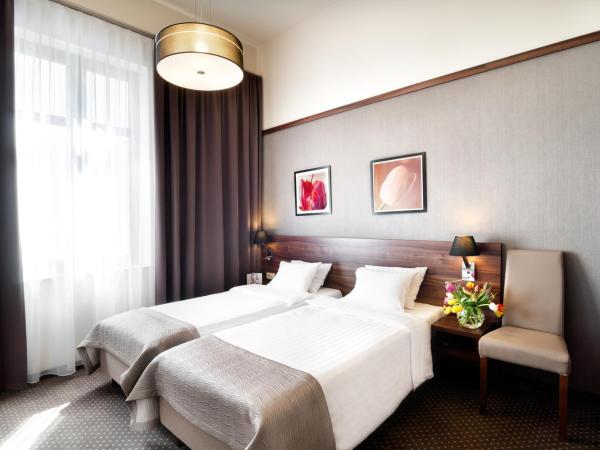 Golden Tulip Krakow City Center : photo 9 de la chambre chambre deluxe double ou lits jumeaux