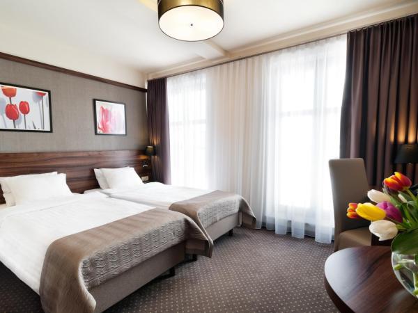 Golden Tulip Krakow City Center : photo 3 de la chambre chambre lits jumeaux