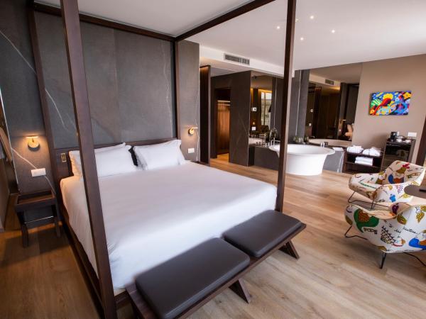 UNAHOTELS MH Matera : photo 1 de la chambre suite décloisonnée