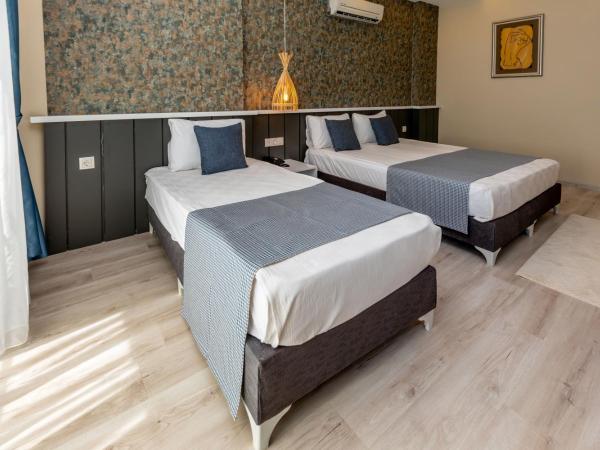 Der Inn Hotel Konyaaltı : photo 2 de la chambre chambre triple