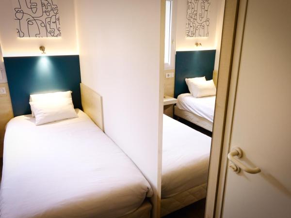 Kyriad Direct Perpignan - Aeroport : photo 6 de la chambre chambre quadruple avec 1 lit double et 2 lits simples