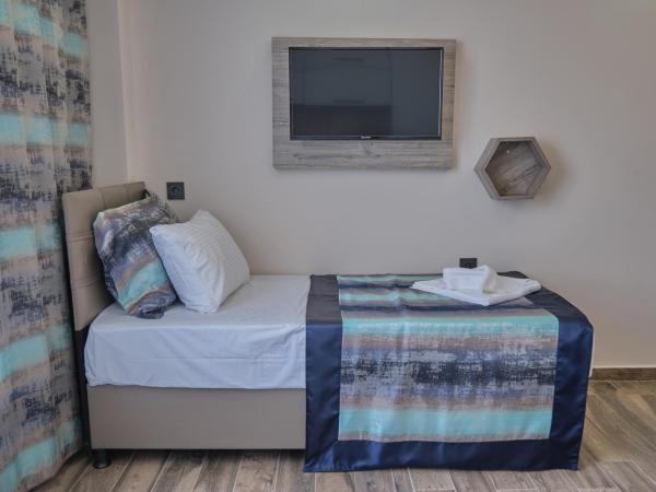 KALİSPERA HOTEL : photo 4 de la chambre chambre double avec salle de bains privative