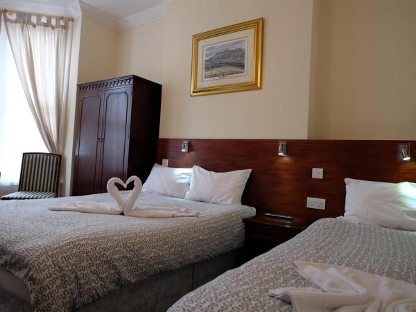 Charlotte Guest House : photo 1 de la chambre chambre triple