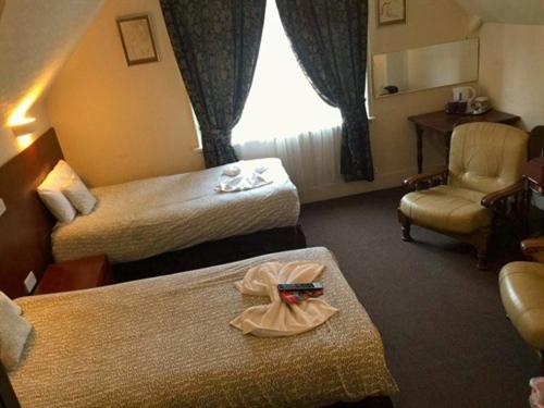 Charlotte Guest House : photo 2 de la chambre chambre lits jumeaux avec salle de bains privative