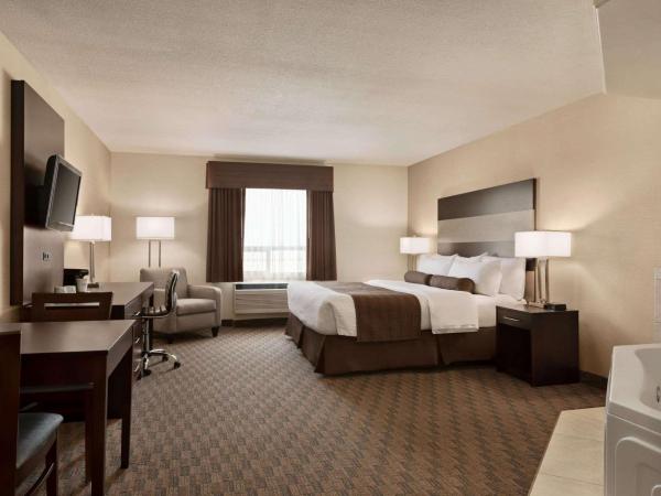 Days Inn by Wyndham Saskatoon : photo 3 de la chambre chambre lit king-size premier - non-fumeurs