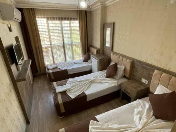 Özgür Hotel : photo 5 de la chambre chambre triple