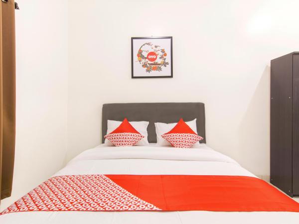 OYO Life 966 Dinda Guesthouse : photo 2 de la chambre chambre double standard