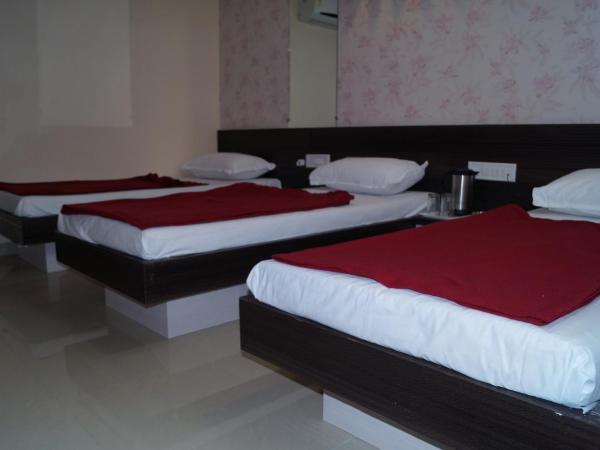 Shree Akshar Restaurant and Hotel : photo 4 de la chambre chambre triple deluxe