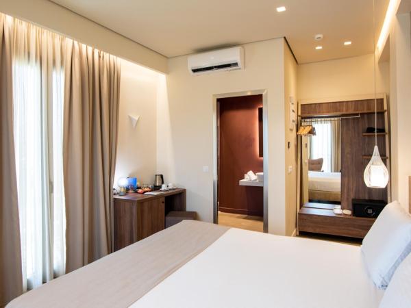 Metropole Urban Hotel : photo 7 de la chambre chambre de luxe avec balcon - vue sur ville