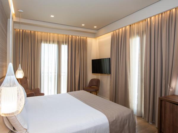 Metropole Urban Hotel : photo 5 de la chambre chambre de luxe avec balcon - vue sur ville