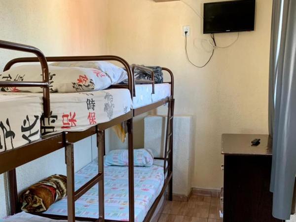 Hostel Horizonte de Minas : photo 2 de la chambre lit simple dans dortoir pour femmes