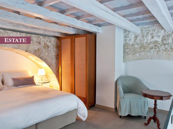 Rimondi Boutique Hotel - Small Luxury Hotels of the World : photo 6 de la chambre suite - vue sur piscine - domaine