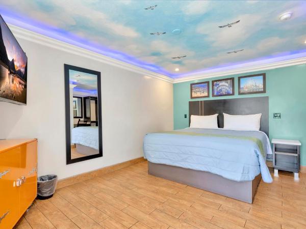 Mid City Inn : photo 1 de la chambre chambre lit king-size deluxe