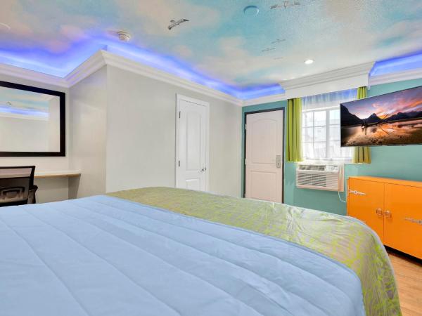 Mid City Inn : photo 3 de la chambre chambre lit king-size deluxe