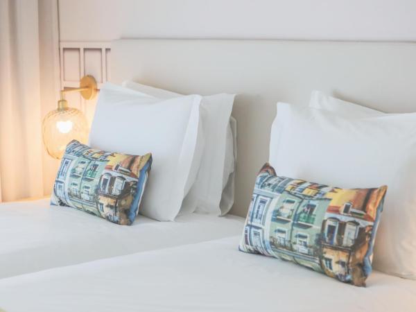Mouraria Lisboa Hotel : photo 2 de la chambre chambre lits jumeaux - vue sur ville