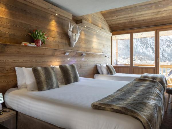 Hôtel Ski Lodge - Village Montana : photo 2 de la chambre chambre triple avec balcon - 3 adultes (13 ans et plus)