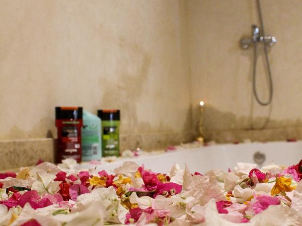 kasbah yu palace : photo 4 de la chambre chambre familiale - vue sur jardin