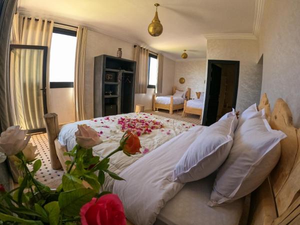 kasbah yu palace : photo 3 de la chambre chambre familiale - vue sur jardin